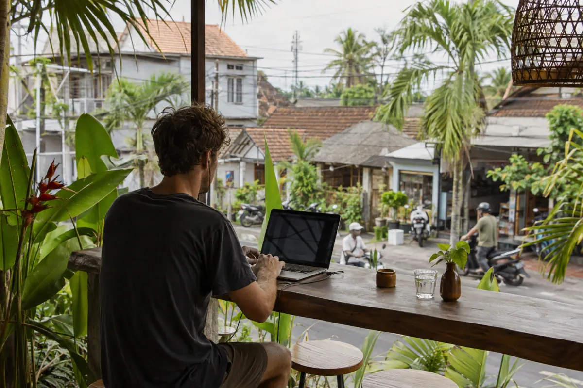 Remote worker at an open-air café on a Canggu neighborhood road